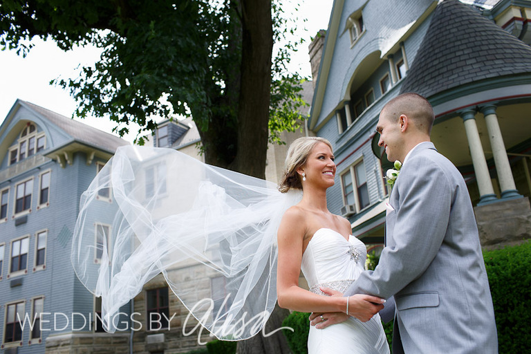 Wedding photos of bride and groom outside church in Morgantown WV