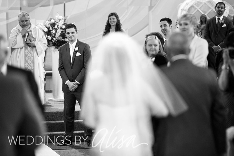 Groom in gray suit waiting for his bride in church in Pittsburgh