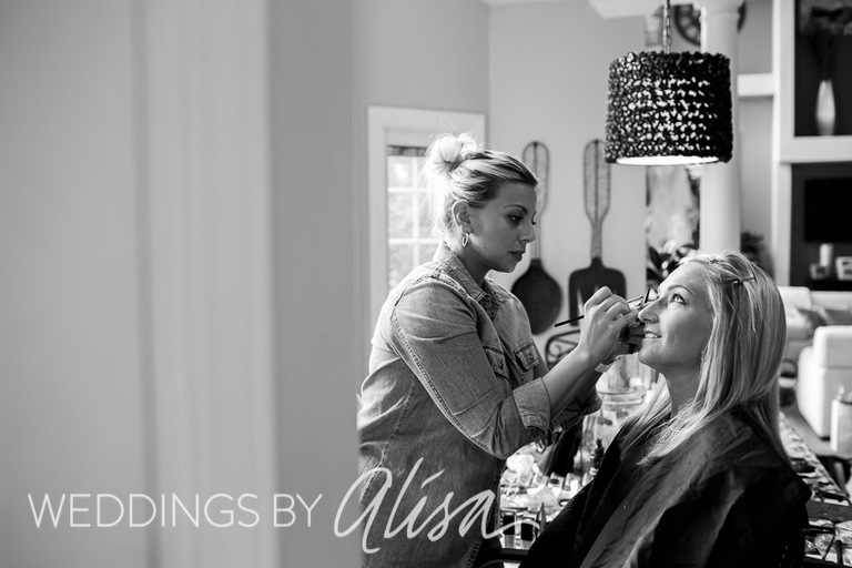 Bride getting makeup done on wedding day in Pittsburgh