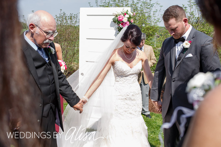 Praying with family at wedding 