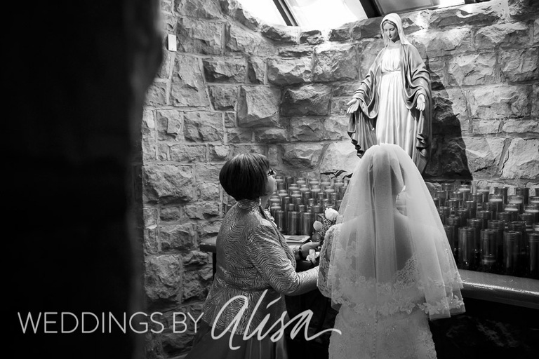 Mother and Daughter praying to blessed mother