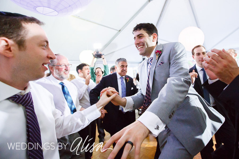 Energetic fun wedding reception under white tent in Pittsburgh