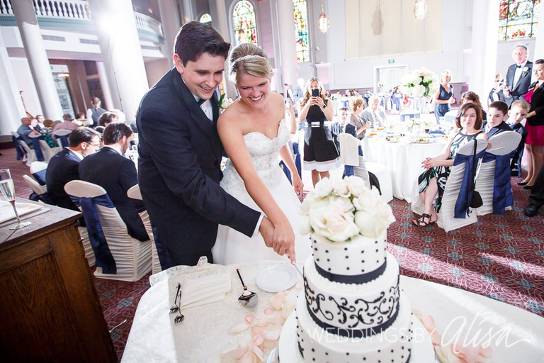Cutting the wedding cake at the reception in Pittsburgh