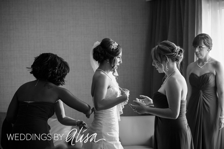 Bridesmaids helping bride get dressed at Pittsburgh Wedding