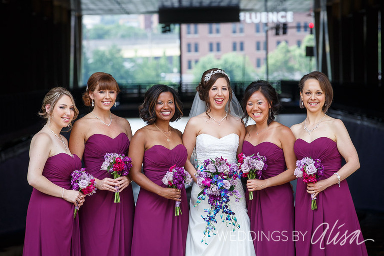 Bride and bridesmaids with blue and purple flowers