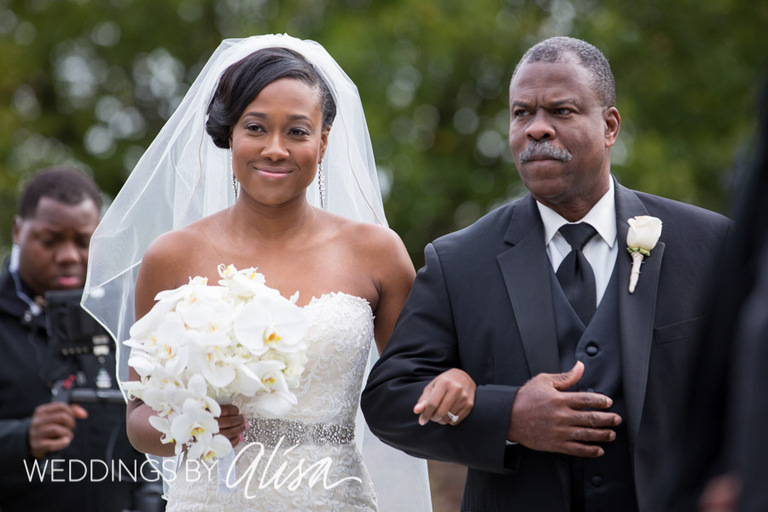 Dad walking down aisle with bride 