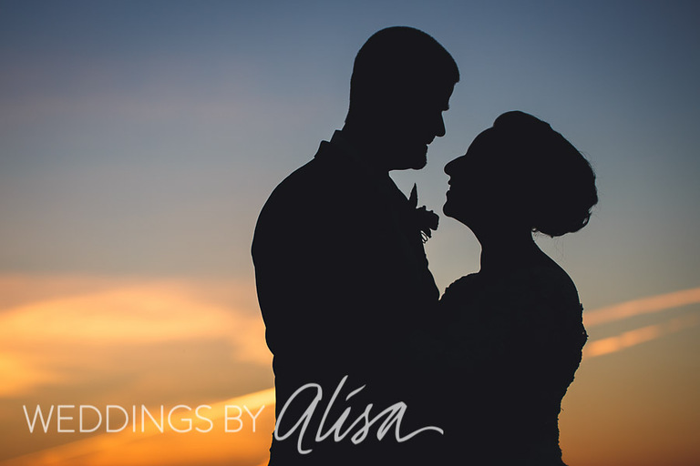 Creative sunset portrait photo of bride and groom