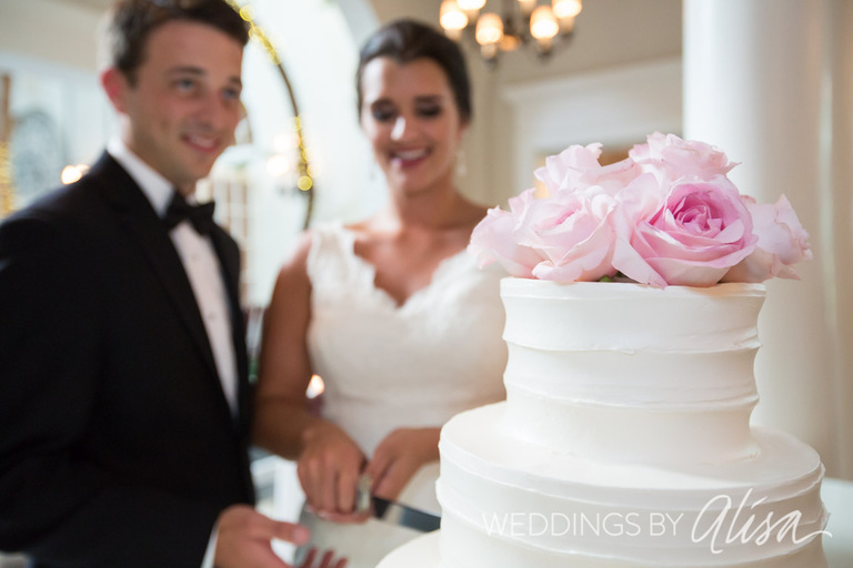 Bride and Groom Cutting the Cake
